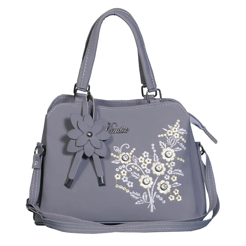 Carry your essentials in style with a flower fashion embroidered handbag, a medium shoulder bag that's easy to maintain.